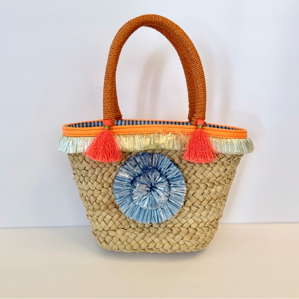 Milly Pom Pom straw small tote with orange and blue tassel accents